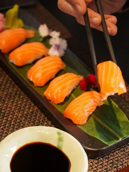 A platter of our classic Salmon Nigiri, ready to be enjoyed. Each piece is handcrafted to perfection, allowing the fresh, clean taste of the salmon to shine.