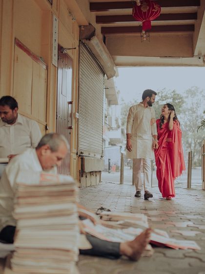 A candid shot of the couple walking through the streets of Old Bombay. We framed them against the backdrop of daily life, making their love story feel authentic and grounded in the city's soul.