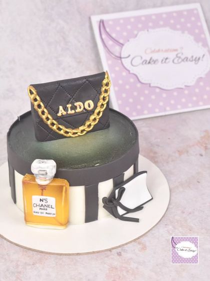 A fashion-themed cake featuring a miniature Aldo handbag and a bottle of Chanel No. 5 perfume. I especially loved hand-painting the perfume bottle to give it a transparent, glass-like effect.