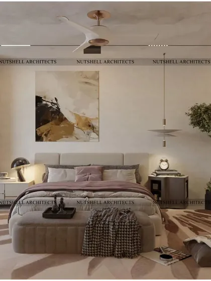 This cozy bedroom design uses warm, earthy tones and natural textures to create a welcoming retreat. An indoor tree adds a touch of nature, while the abstract art and modern furniture keep the space feeling contemporary.