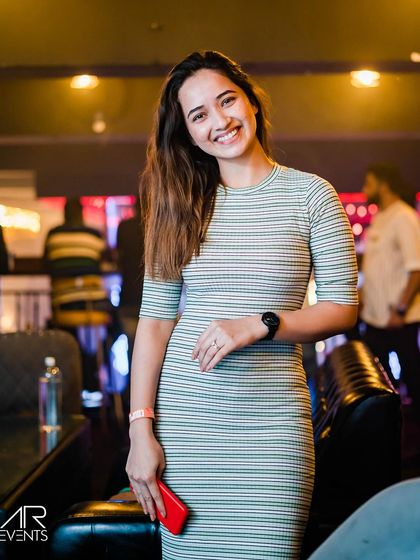 A guest posing at the bar.