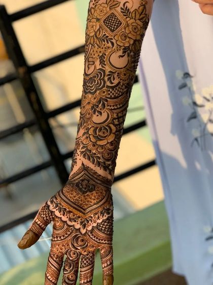 Another view of the same full arm design, highlighting the delicate shading and line work involved.