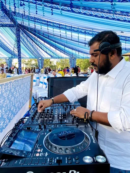 DJing a beautiful daytime function under a decorated tent. I adapt to any setting, ensuring the music for your wedding events is just right, whether it's a relaxed gathering or the main event.