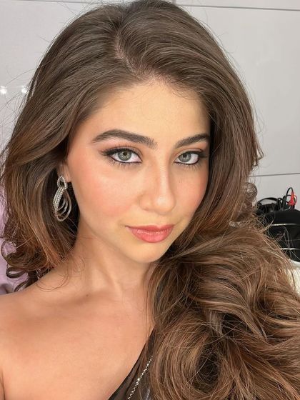 A selfie-style close-up of Aditi Bhatia, capturing her stunning eyes and the sparkle of her earrings.