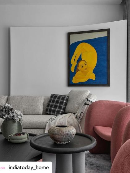 A duplicate of image 20, this shot from India Today Home emphasizes the living room's standout feature: a curved white wall that serves as a stunning backdrop for artwork, enhancing the room's visual appeal.