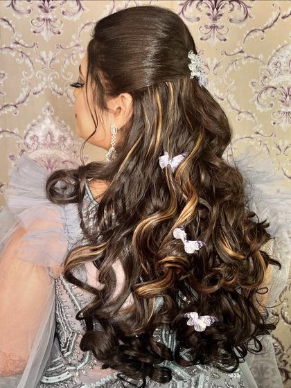 Another angle of the "baby doll" hairstyle, showing the beautiful placement of the butterfly clips throughout the soft curls.