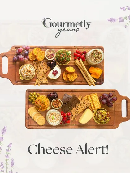 Cheese Alert! This image showcases two of our beautiful cheese boards, featuring a variety of our unique cheese domes, crackers, fruits, and nuts.