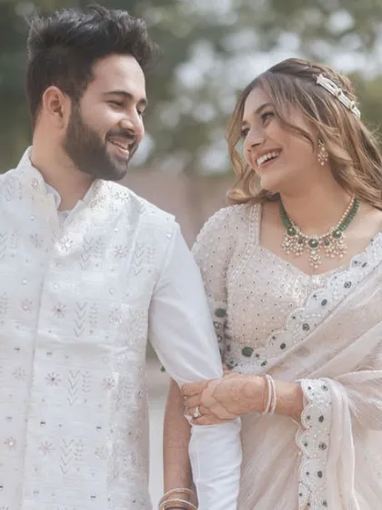 A happy, candid shot of the couple. The bride's natural beauty shines through with this simple and elegant look.