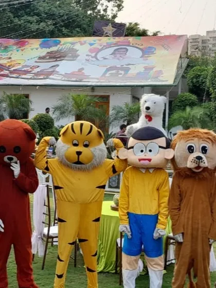 We have a whole team of characters ready for your event. This photo shows a lineup of our mascots, including a bear, tiger, and Nobita, perfect for a carnival or large party.