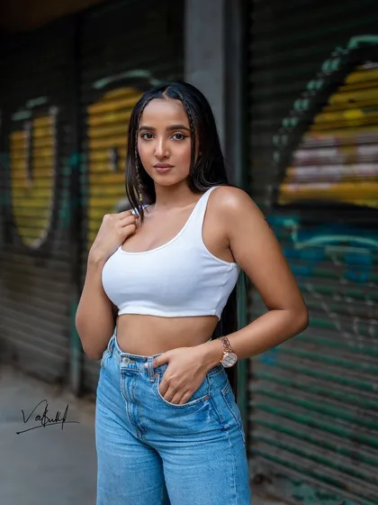 A simple yet striking street fashion portrait. This shot proves that a great photo doesn't always need a complex concept, just a compelling subject, good light, and an urban backdrop with character.