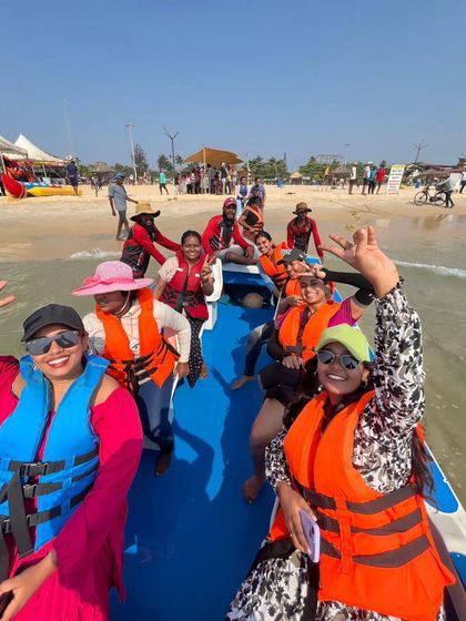 A fun action shot of our group on a boat at Malpe beach.