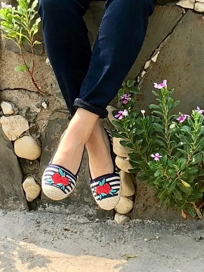 Your footwear can define your outfit. These quirky and comfortable espadrilles with embroidered details are a staple in my collection for adding a pop of fun to any casual look, especially with simple jeans.