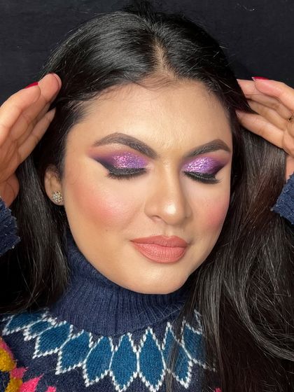 A live tutorial look featuring a dramatic purple glitter eye. I love teaching these bold, creative styles.