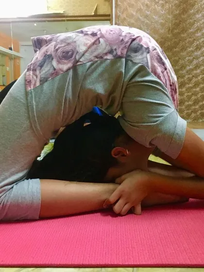 Adhomukha Kapotasana, an advanced back-bending pose. This requires a lot of preparation to reduce stiffness in the hips and spine.