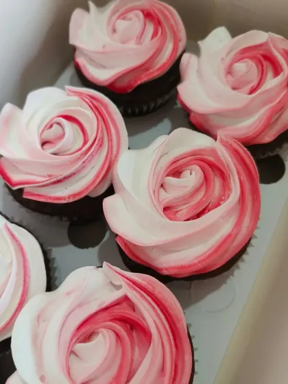 These two-tone rosette cupcakes are simple, elegant, and so pretty. The blend of pink and white frosting off creates a beautiful floral effect, perfect for a baptism or bridal shower.