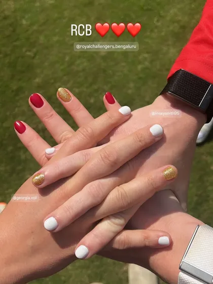 I was so honored and grateful to do the nails for the amazing women cricketers of the Royal Challengers Bangalore. This picture of their hands together, showing off their team-colored manicures, is a moment I'll never forget.