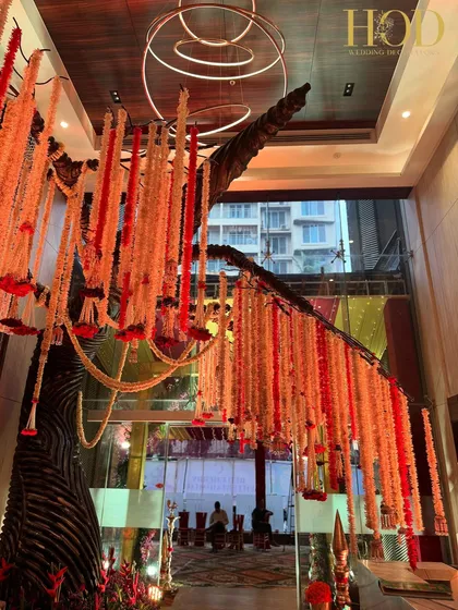 A wide shot of the floral tree installation, showing how it can transform a lobby or entrance area into a spectacular focal point.