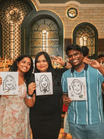 Fun and engagement at a corporate gathering. Guests show off their caricature portraits, a unique entertainment option that I can help arrange to make your event more memorable.