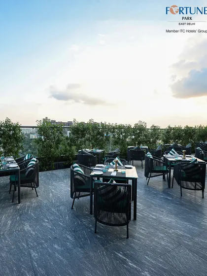 The spacious layout of Nakshatra offers plenty of room to dine in comfort while enjoying the open sky and lush green accents.