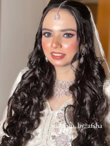 A beautiful, happy portrait of the bride in white.