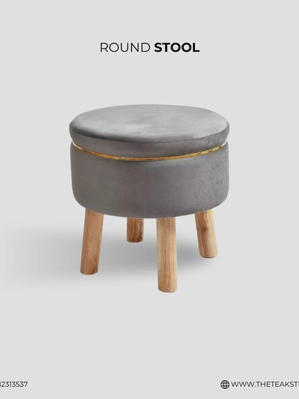 A studio shot of our grey velvet round stool, highlighting its clean lines and modern design. The combination of soft velvet, metal trim, and light wood legs works in any contemporary space.