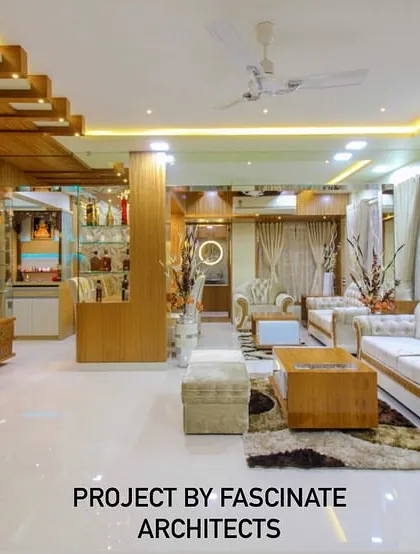 A spacious living room in a Vashi duplex, featuring light wood tones and classic white sofas. The design includes a custom bar and display unit, showcasing our ability to integrate entertainment and storage solutions seamlessly.