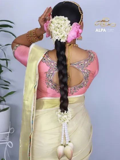 Another angle of the traditional braid, showing the placement of the fresh flowers and the pearl accessories.