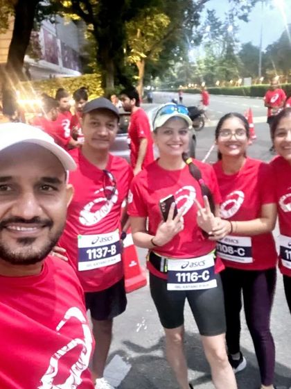 A candid selfie capturing the happy faces of our running family during a group event.