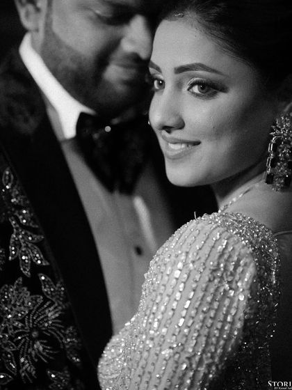 A beautiful black and white close-up of Shivam and Diksha, their proximity and soft smiles conveying deep intimacy.