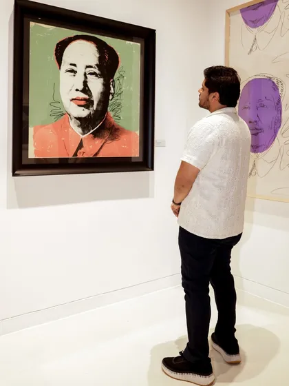 A guest admiring a portrait of Mao by Andy Warhol. The music I selected for the night was designed to match the revolutionary and glamorous energy of Warhol's pop art.