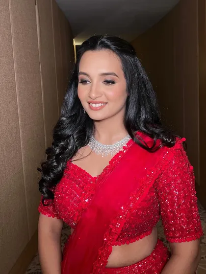 Glow level: INFINITE. When your makeup has you shining from the inside out. This client is ready for her reception in a stunning red lehenga.