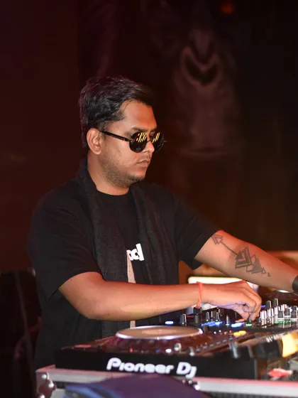 A quick intermission during a long set at Tipsy Bro. Staying focused and energized is key to a successful night.