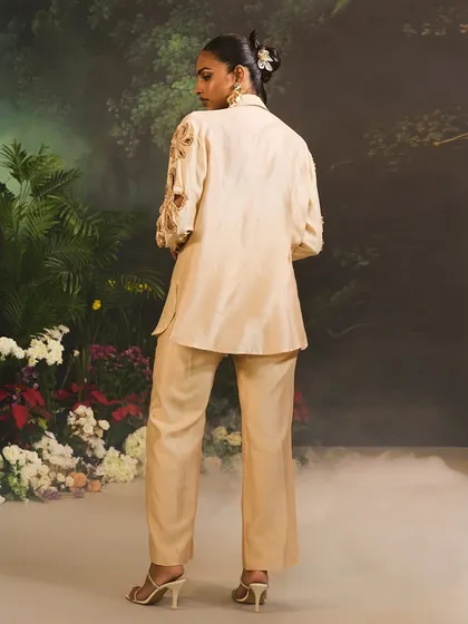 The back view of the beige Lunara Co-Ord Set, highlighting the clean tailoring and modern silhouette.