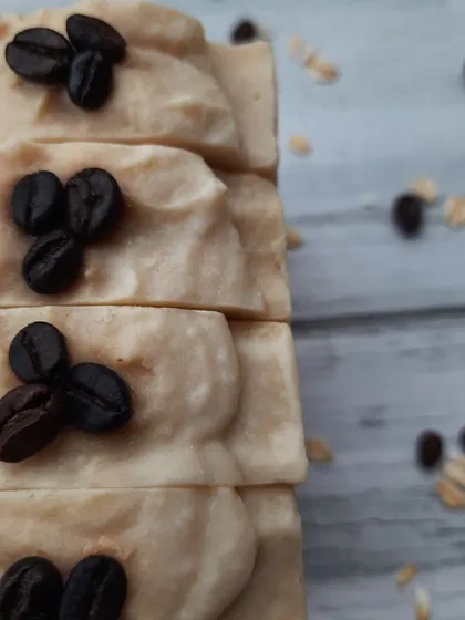 A close-up of the textured top of my Scrubby Coffee soap. I top each bar with a few whole coffee beans, a nod to the wonderful ingredient inside.