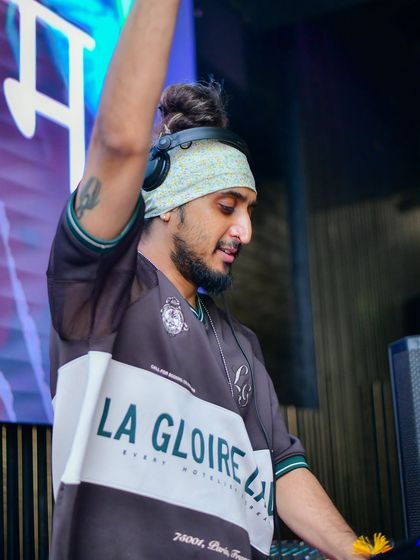 Hand in the air, feeling the beat. This is me in my element, connecting with the music and the crowd.