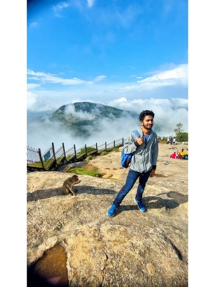 A quiet moment at Nandi Hills with a new friend. Even on group trips, there are peaceful moments to connect with nature.