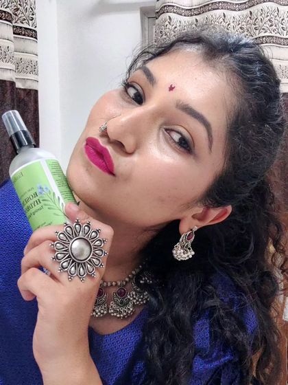 This customer is all smiles holding our Rosemary Hydrosol. It's a natural and gentle way to refresh and balance your skin, and many of our users love it for both skin and hair benefits.