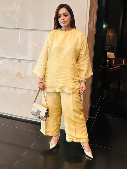 The beauty of a co-ord set like this is its simplicity. The monochrome yellow look is modern and fresh, while the silk-like fabric adds a touch of luxury.