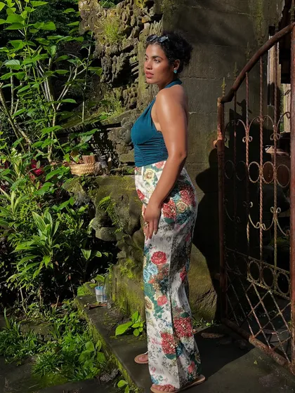 This Barbie is not made for laptops and 9-5s. Exploring the lush greenery of Ubud in floral pants and a teal halter top. This is a great example of a comfortable yet stylish outfit for a day of sightseeing.