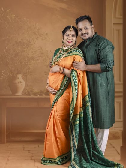 A full-length portrait showcasing the couple in elegant traditional wear. This shot captures their grace and the cultural significance of the moment.