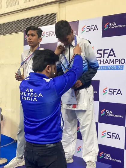 Dhanraj receiving his gold medal in the U-17 category at the SFA Championship. A moment of triumph.