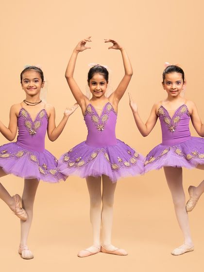 Our little ballerinas posing for their performance of 'Coppélia Reimagined.' Their doll like elegance and static poses are central to this whimsical and charming ballet piece.
