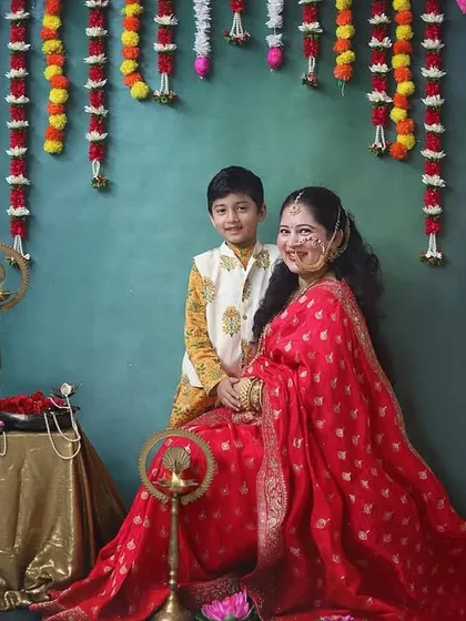 The bond between a mother and her firstborn is so special. Here, he joins her in this traditional maternity shoot, ready to welcome his new sibling into the family.