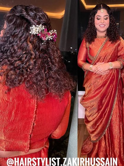 I love working with naturally curly hair to enhance its beauty. This half-up style features a simple twist and is adorned with fresh flowers, celebrating the hair's natural texture.