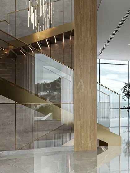 I believe staircases should be more than just functional; they should be sculptural art pieces. In this villa, the staircase is a central feature, combining polished marble, warm veneers, and shimmering golden accents. It’s designed to draw the eye upward and create an experience of layered luxury as you move through the home.