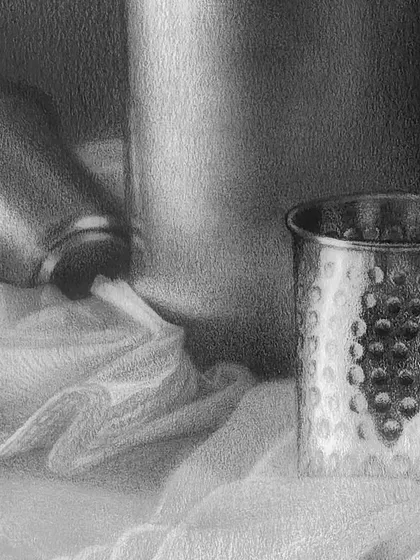 A detailed view of the metallic glasses and fabric, highlighting the interplay of light, shadow, and reflection.