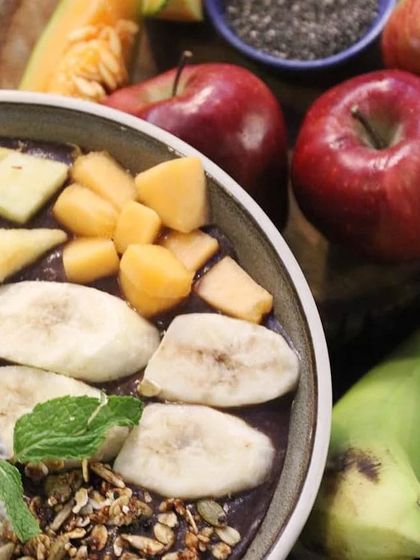 A close-up of our smoothie bowl, showing the vibrant colors and textures of the fresh fruit and granola toppings. It's a feast for the eyes and the body.