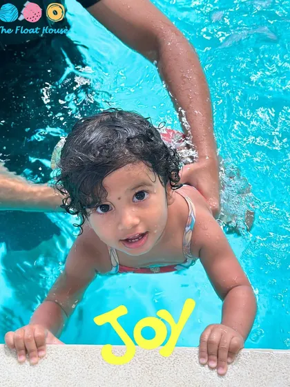 The pure joy on this little swimmer's face says it all. We focus on creating positive first experiences in our warm, ozonized pool.