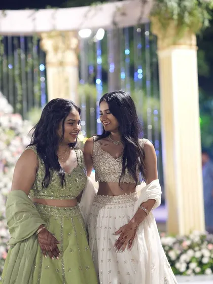 A candid moment between two sisters, both dressed in our curated lehengas. It’s these shared moments of joy and celebration that we love to be a part of.