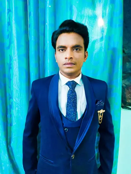 A reception makeover for a client with a dusky skin tone. The navy blue suit is a great color choice, and the makeup provides a clean, polished finish.